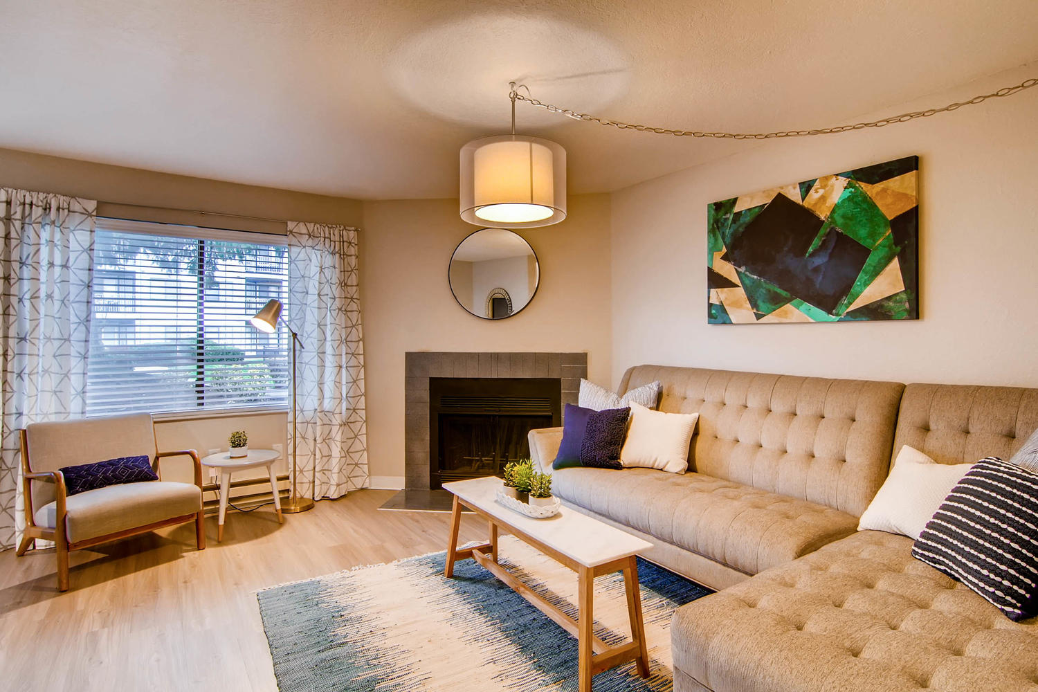 Living room with fireplace at Arterra apartments in the 98204 area