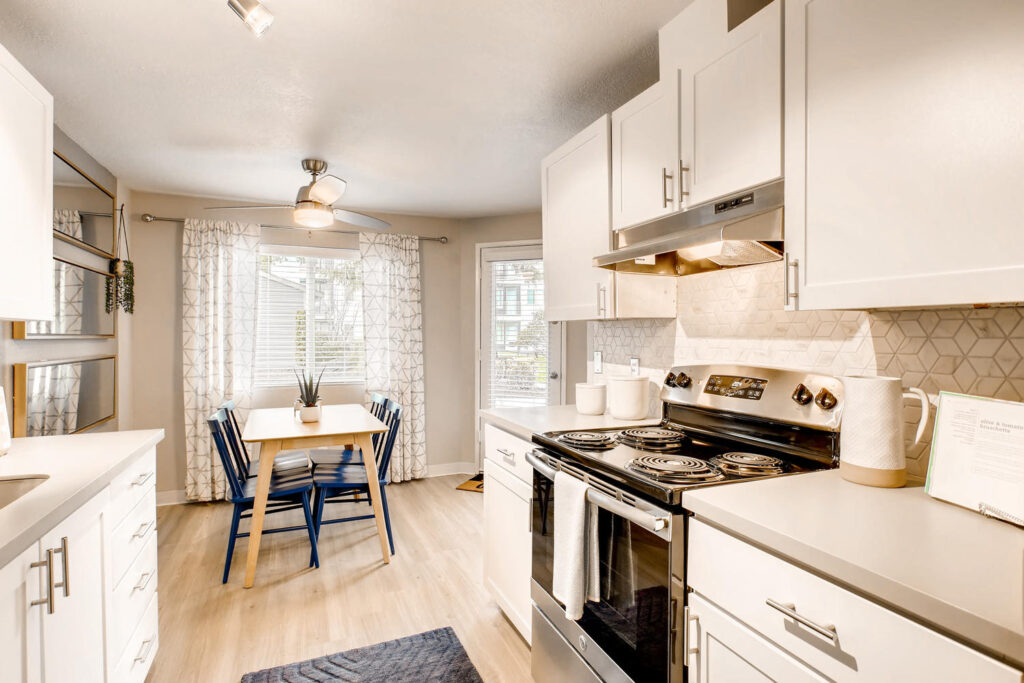 Kitchen with wood-style flooring at Everett apartment rentals in Snohomish County.
