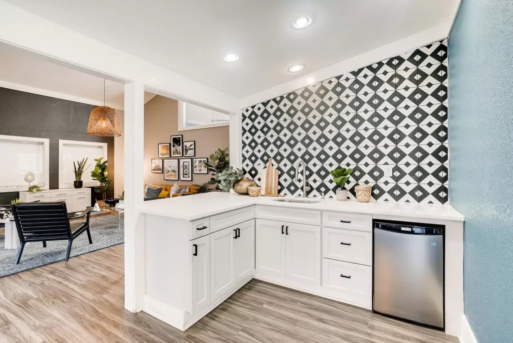 Clubhouse interior with kitchenette and lounge seating