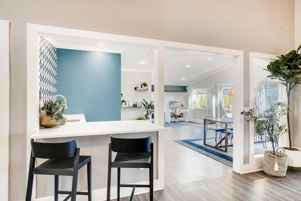 Clubhouse interior with table seating and computer desks