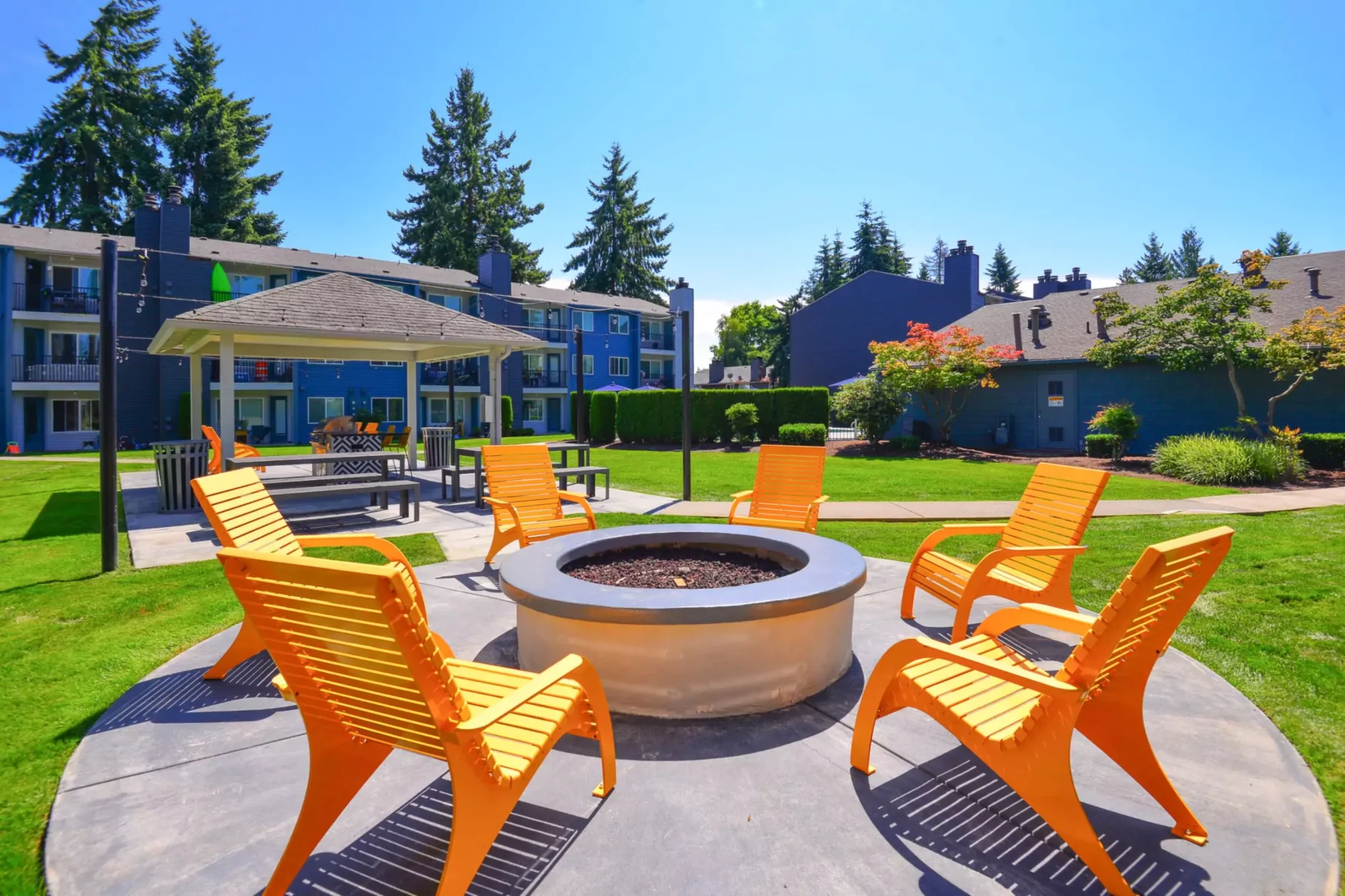 Outdoor fire pit and picnic area at Arterra apartments for rent in Everett, WA